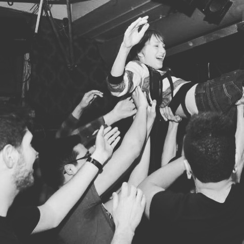 Performer held up by the crowd